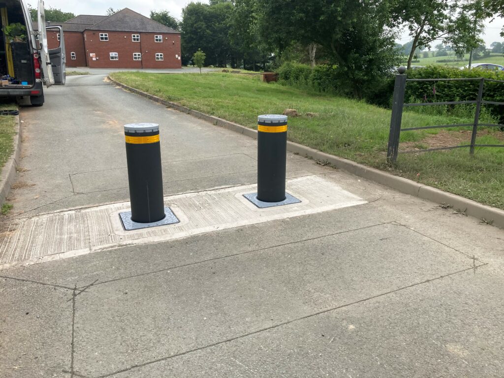 Heavy-duty traffic barriers installed to prevent unauthorised vehicle access to industrial sites, enhancing security and safety.