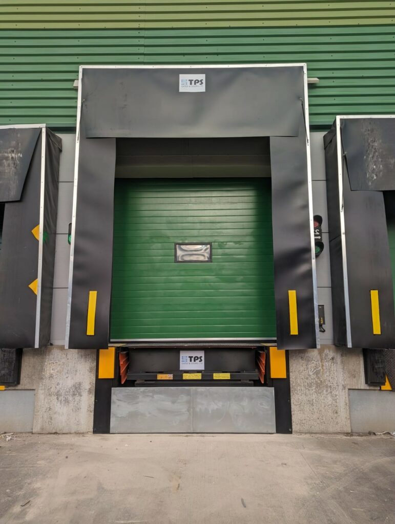 Warehouse loading bay with integrated hydraulic dock leveller, providing efficient truck docking and unloading, installed by TPS Industrial