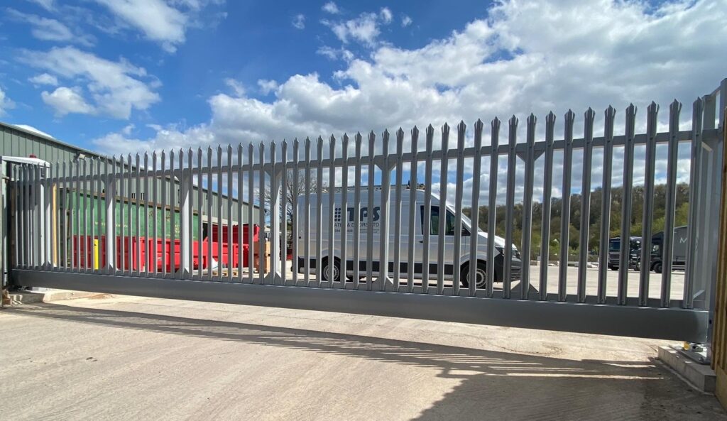 Automatic sliding gate with high-security locking mechanism, providing controlled access for industrial sites, installed by TPS Industrial.